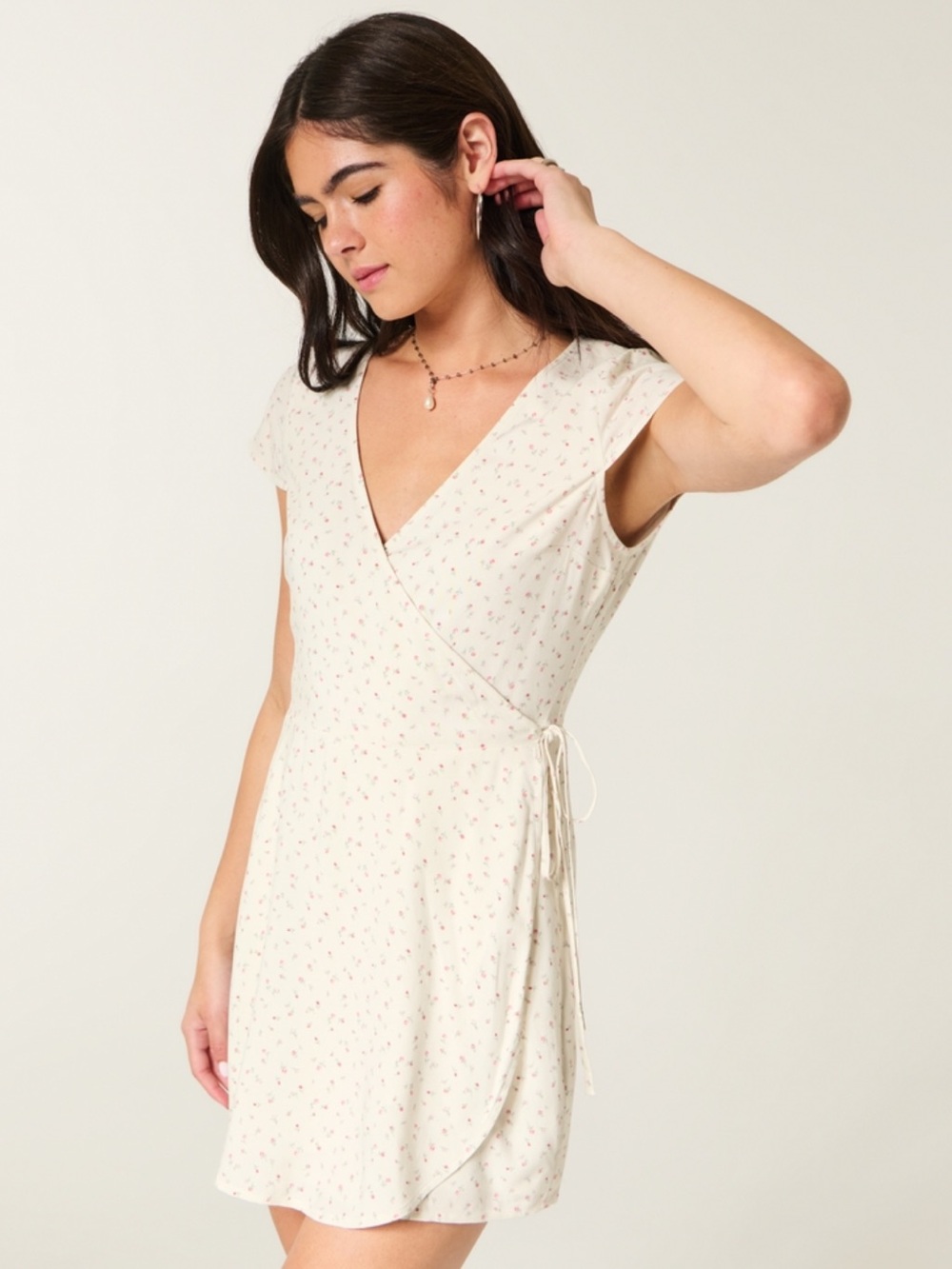 Hollister Cream mini dress with small floral print, size XXS. Brand new with tag